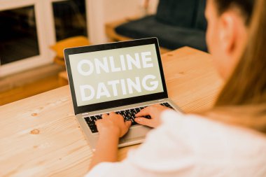 Conceptual hand writing showing Online Dating. Business photo text Searching Matching Relationships eDating Video Chatting woman with laptop smartphone and office supplies technology. clipart
