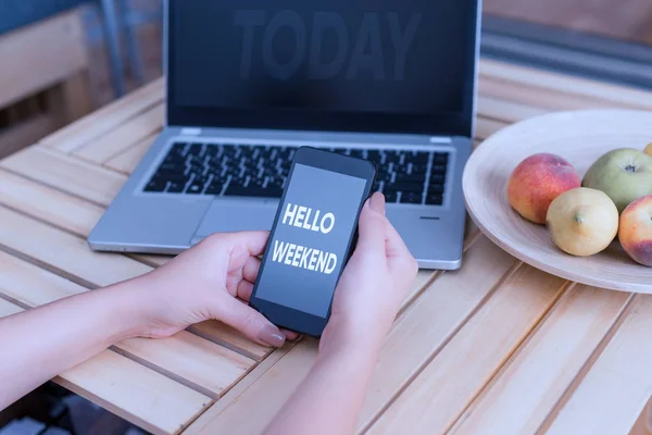 Conceptual hand writing showing Hello Weekend. Business photo showcasing Getaway Adventure Friday Positivity Relaxation Invitation woman with laptop smartphone and office supplies technology. — Stock Photo, Image