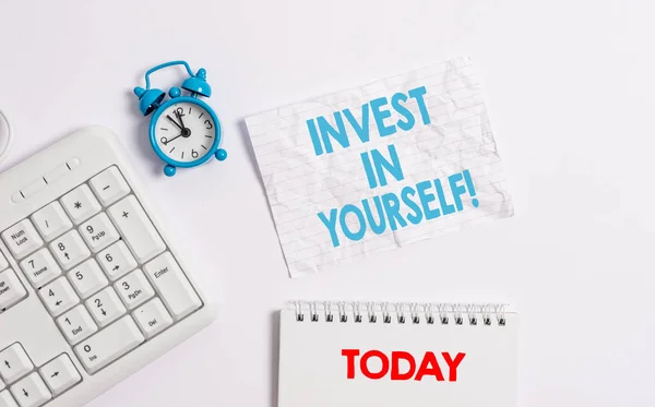 Text sign showing Invest In Yourself. Conceptual photo learn new things or materials thus making your lot better Blank paper with copy space on the table with clock and pc keyboard. — Stock Photo, Image
