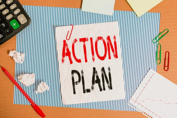 Text sign showing Action Plan. Conceptual photo detailed plan outlining actions needed to reach goals or vision Striped paperboard notebook cardboard office study supplies chart paper.