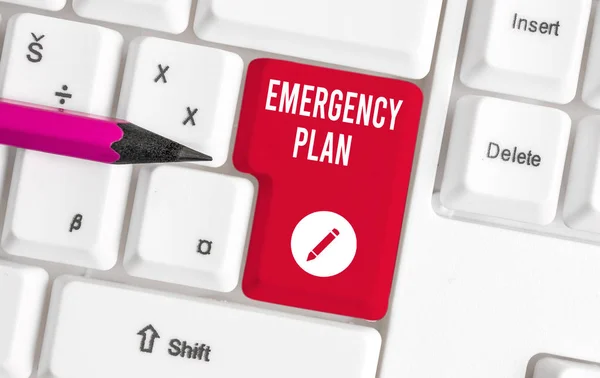 Writing note showing Emergency Plan. Business photo showcasing procedures for handling sudden or unexpected situations White pc keyboard with note paper above the white background. — Stock Photo, Image