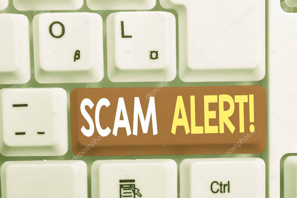 Writing note showing Scam Alert. Business photo showcasing fraudulently obtain money from victim by persuading him White pc keyboard with note paper above the white background.