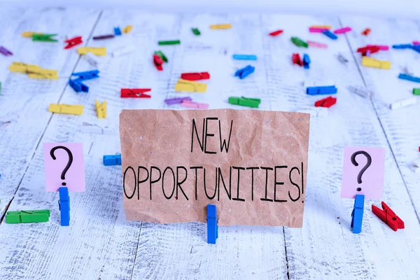 Text sign showing New Opportunities. Conceptual photo exchange views condition favorable for attainment goal Scribbled and crumbling sheet with paper clips placed on the wooden table.