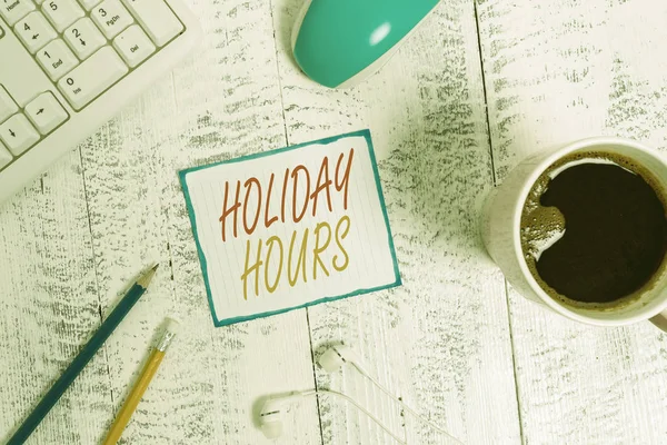 Writing note showing Holiday Hours. Business photo showcasing employee receives twice their normal pay for all hours Technological devices colored reminder paper office supplies. — Stock Photo, Image