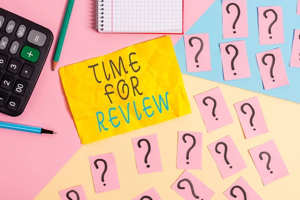 Writing note showing Time For Review. Business photo showcasing review of a system or situation in its formal examination Mathematics stuff and writing equipment above pastel colours background.