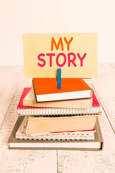 Conceptual hand writing showing My Story. Business photo text the things or situations that have happened to someone in life pile stacked books notebook pin color reminder white wooden. — Stock Photo, Image