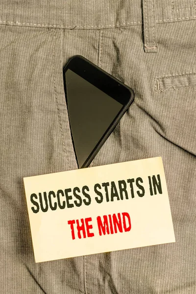 Word writing text Success Starts In The Mind. Business concept for set your mind to positivity it can go a long way Smartphone device inside formal work trousers front pocket near note paper.