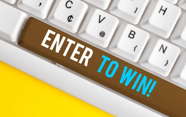 Handwriting text Enter To Win. Concept meaning exchanging something value for prize chance winning prize White pc keyboard with empty note paper above white background key copy space.