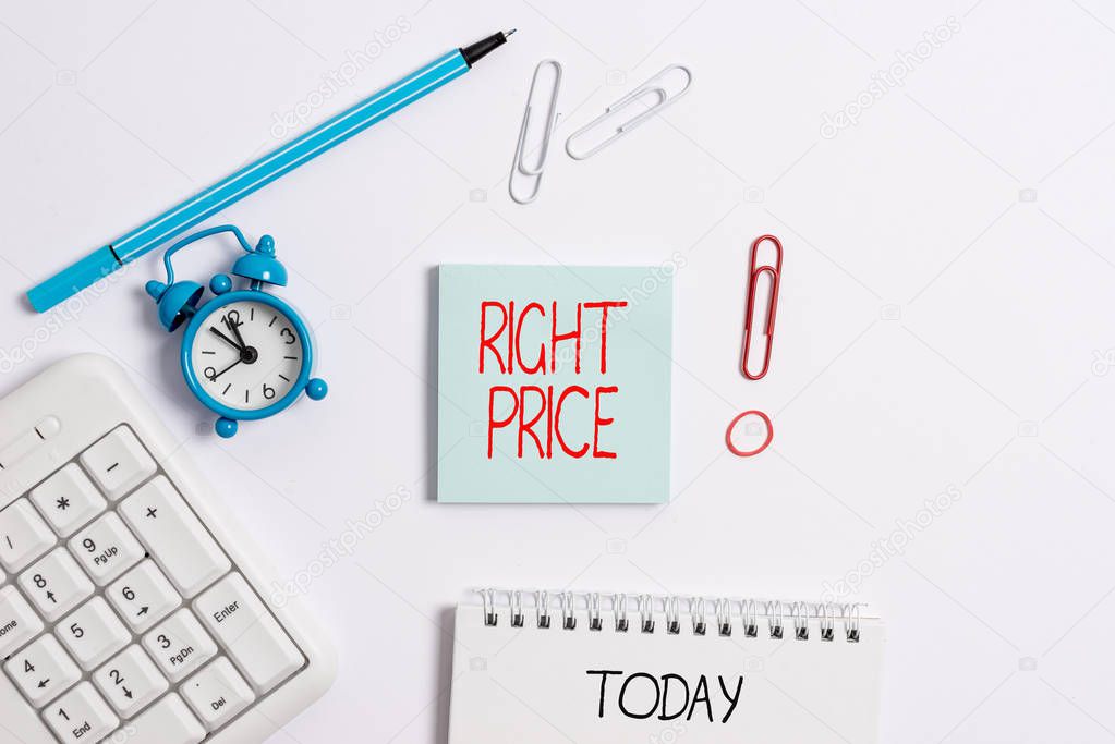 Writing note showing Right Price. Business photo showcasing the amount of money that it is reasonable for the product Copy space on empty note paper with clock and pencil on the table.