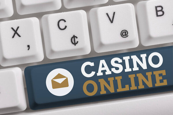 Word writing text Casino Online. Business concept for Computer Poker Game Gamble Royal Bet Lotto High Stakes White pc keyboard with empty note paper above white background key copy space.