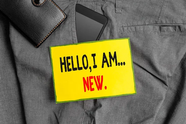 Conceptual hand writing showing Hello I Am New. Business photo showcasing introducing oneself in a group as fresh worker or student Smartphone device inside trousers front pocket with wallet.
