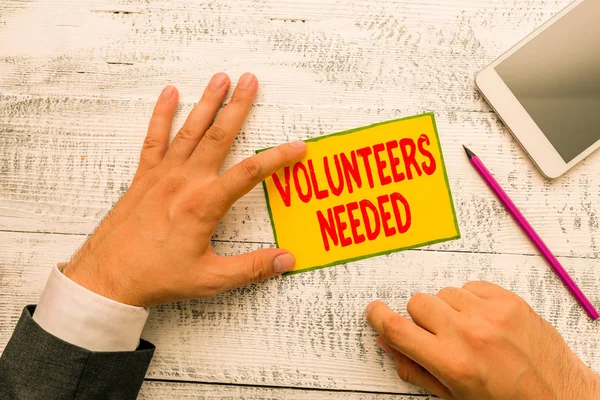 Handwriting text writing Volunteers Needed. Concept meaning need work or help for organization without being paid.