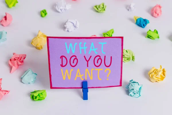 Writing note showing What Do You Want Question. Business photo showcasing say or write in order to ask demonstrating about something Colored crumpled paper empty reminder white floor clothespin.