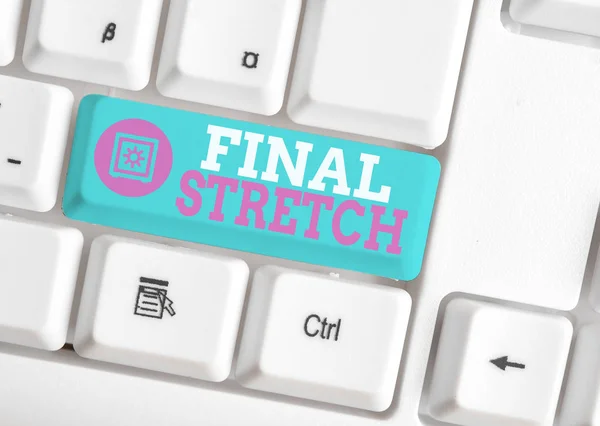 Writing note showing Final Stretch. Business photo showcasing Last Leg Concluding Round Ultimate Stage Finale Year ender White pc keyboard with note paper above the white background. — Stock Photo, Image