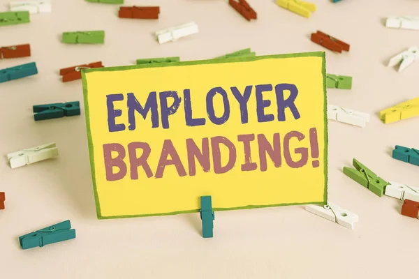 Word writing text Employer Branding. Business concept for promoting company employer choice to desired target group Colored clothespin papers empty reminder pink floor background office pin.