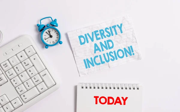 Text sign showing Diversity And Inclusion. Conceptual photo range huanalysis difference includes race ethnicity gender Blank paper with copy space on the table with clock and pc keyboard.