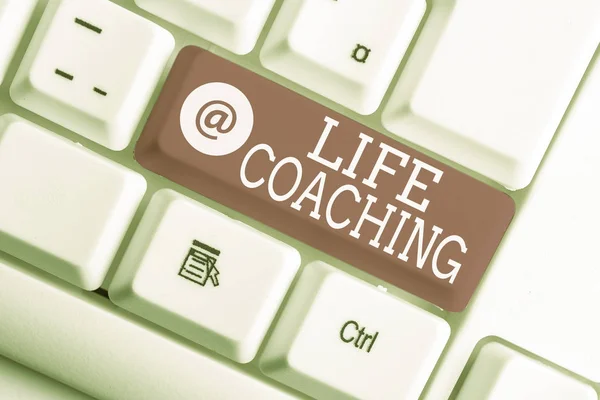 Writing note showing Life Coaching. Business photo showcasing Improve Lives by Challenges Encourages us in our Careers White pc keyboard with note paper above the white background.