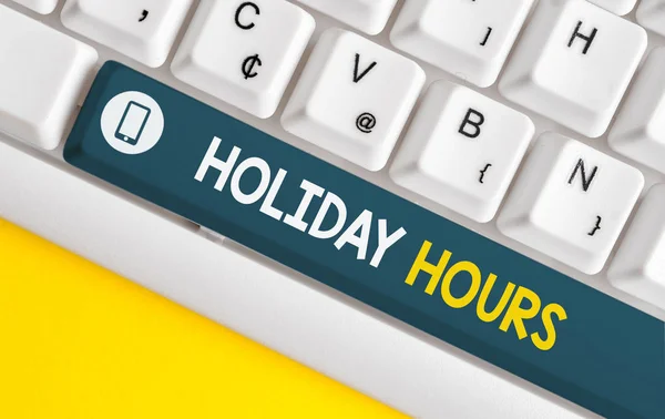 Word writing text Holiday Hours. Business concept for employee receives twice their normal pay for all hours White pc keyboard with empty note paper above white background key copy space. — Stock Photo, Image