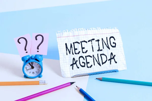 Handwriting text writing Meeting Agenda. Concept meaning items that participants hope to accomplish at a meeting.