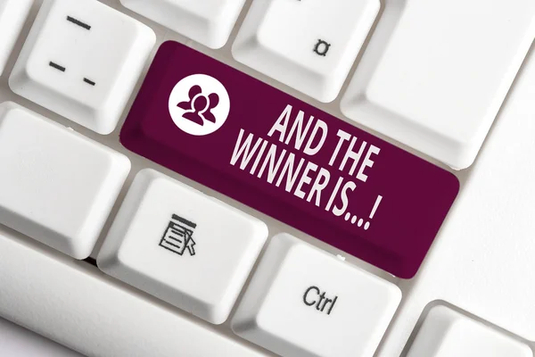 Word writing text And The Winner Is. Business concept for announcing who got first place at competition or exam White pc keyboard with empty note paper above white background key copy space. — Stock Photo, Image