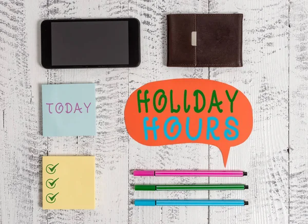 Word writing text Holiday Hours. Business concept for Schedule 24 or7 Half Day Today Last Minute Late Closing Smartphone pens blank speech bubble sticky notes wallet wooden background.