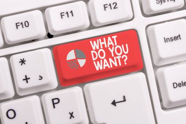 Ne İstersiniz Soru gösteren kavramsal el yazısı. İş fotoğrafı metin demek veya beyaz arka plan üzerinde not kağıdı ile beyaz pc klavye bir şey hakkında gösteren sormak için yazmak.