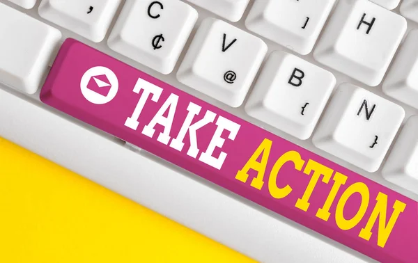 Текст для написания слов Take Action. Business concept for to do something thingoract in order to get a particular result White pc keyboard with empty note paper above white background key copy space . — стоковое фото