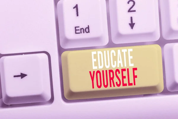 Writing note showing Educate Yourself. Business photo showcasing prepare oneself or someone in a particular area or subject White pc keyboard with note paper above the white background.