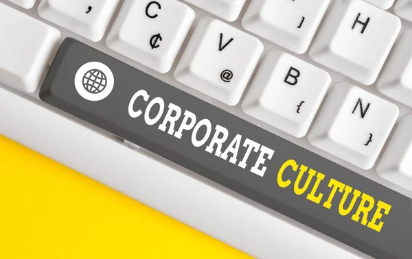 Writing note showing Corporate Culture. Business photo showcasing pervasive values and attitudes that characterize a company White pc keyboard with note paper above the white background.