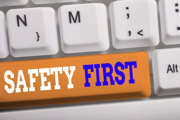 Word writing text Safety First. Business concept for used to say that the most important thing is to be safe White pc keyboard with empty note paper above white background key copy space. — Stock Photo, Image