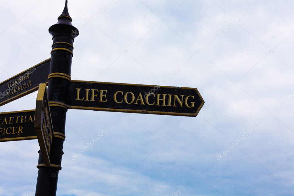 Text sign showing Life Coaching. Conceptual photo Improve Lives by Challenges Encourages us in our Careers Road sign on the crossroads with blue cloudy sky in the background.