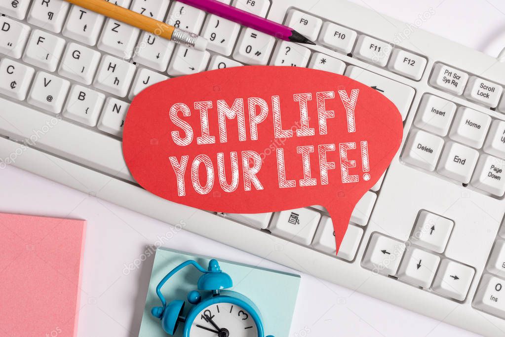 Handwriting text Simplify Your Life. Concept meaning focused on important and let someone else worry about less ones Empty copy space red note paper bubble above pc keyboard for text message.