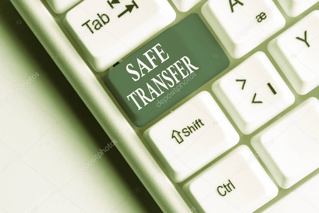 Text sign showing Safe Transfer. Conceptual photo Wire Transfers electronically Not paper based Transaction White pc keyboard with empty note paper above white background key copy space.