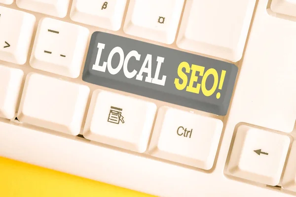 Texto de escritura de palabras Local Seo. Concepto de negocio para una manera increíblemente efectiva de comercializar su cerca de negocios en línea Teclado de PC blanco con papel de nota vacío sobre el espacio de copia de clave de fondo blanco . — Foto de Stock