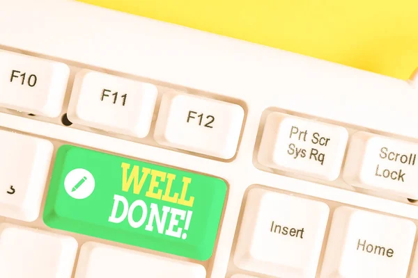 Text sign showing Well Done. Conceptual photo used praising demonstrating or group for something have done good way White pc keyboard with empty note paper above white background key copy space.