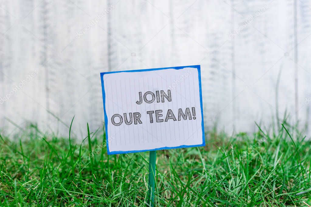 Handwriting text Join Our Team. Concept meaning invite someone to work together for particular purpose target Plain empty paper attached to a stick and placed in the green grassy land.