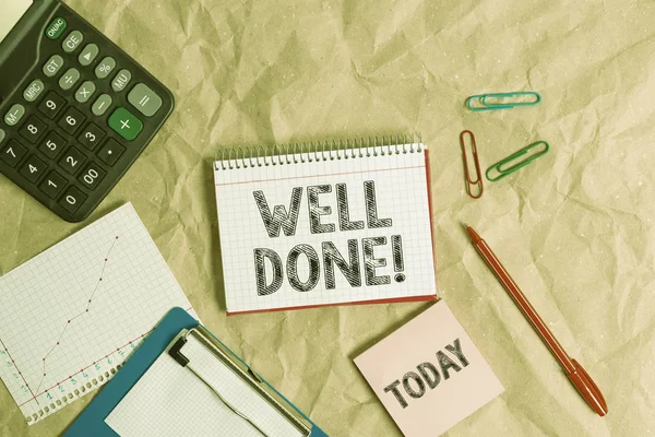 Writing note showing Well Done. Business photo showcasing used praising demonstrating or group for something have done good way Papercraft desk square spiral notebook office study supplies.