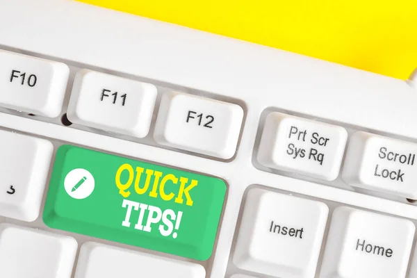 Text sign showing Quick Tips. Conceptual photo small but particularly useful piece of practical advice White pc keyboard with empty note paper above white background key copy space.