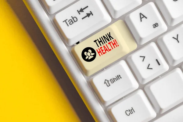 Texto escrito por palavras Think Health. Conceito de negócio para o estado de completo bem-estar físico mental e social Teclado de PC branco com papel de nota vazio acima do espaço de cópia de chave de fundo branco . — Fotografia de Stock