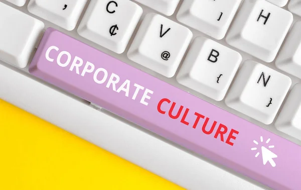 Writing note showing Corporate Culture. Business photo showcasing pervasive values and attitudes that characterize a company White pc keyboard with note paper above the white background.