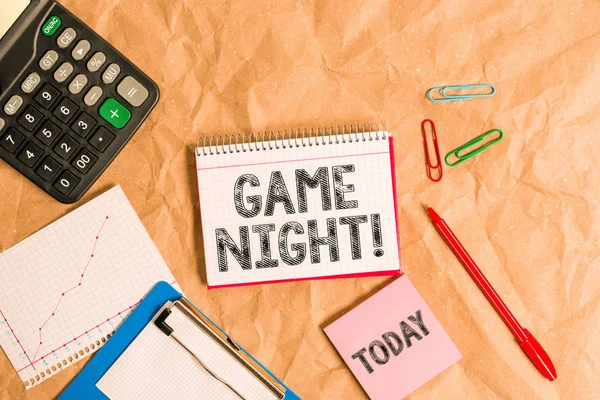 Writing note showing Game Night. Business photo showcasing usually its called on adult play dates like poker with friends Papercraft desk square spiral notebook office study supplies.