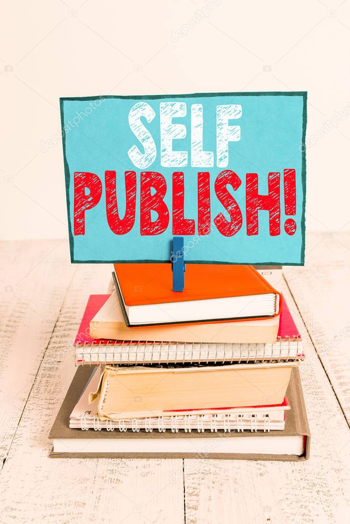 Writing note showing Self Publish. Business photo showcasing writer publish piece of ones work independently at own expense pile stacked books notebook pin color reminder white wooden.