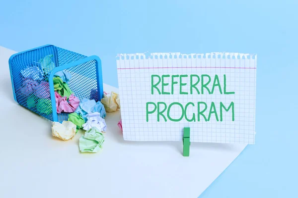 Text sign showing Referral Program. Conceptual photo employees are rewarded for introducing suitable recruits Trash bin crumpled paper clothespin empty reminder office supplies tipped.