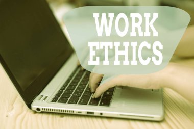 Conceptual hand writing showing Work Ethics. Business photo showcasing A set of values centered on the importance of doing work woman with laptop smartphone and office supplies technology.