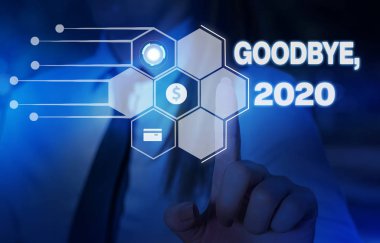Kelime yazma metin Goodbye 2020. Yeni Yıl Arifesi Milestone Geçen Ay Kutlama Geçiş Kadın için İş konsepti akıllı cihaz kullanarak sunum sunan resmi iş elbisesi giymek.