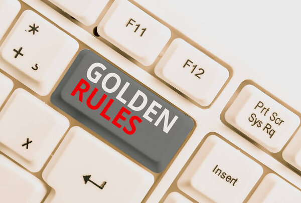 Writing note showing Golden Rules. Business photo showcasing Basic principle that should be followed Important Principle White pc keyboard with note paper above the white background.