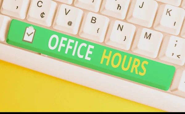 Handwriting text writing Office Hours. Concept meaning The hours which business is normally conducted Working time White pc keyboard with empty note paper above white background key copy space.
