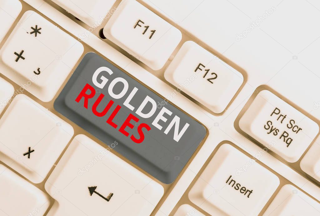 Writing note showing Golden Rules. Business photo showcasing Basic principle that should be followed Important Principle White pc keyboard with note paper above the white background.