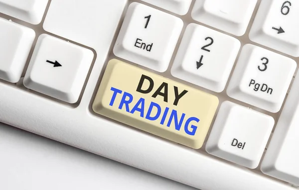 Text sign showing Day Trading. Conceptual photo securities specifically buying and selling financial instruments White pc keyboard with empty note paper above white background key copy space.
