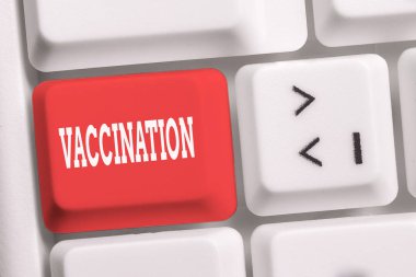 Aşı yazma el yazısı metin. Kavram anlamı Enfeksiyona karşı vücudu daha güçlü kılan Tedavi Beyaz pc klavye beyaz arka plan anahtar kopyalama alanı üzerinde boş not kağıdı ile.